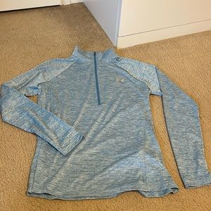 Under Armour light blue loose quarter zip shirt.